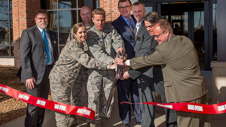 Soldiers and builders come together to cut the ribbon on a Scott Air Force Base project.