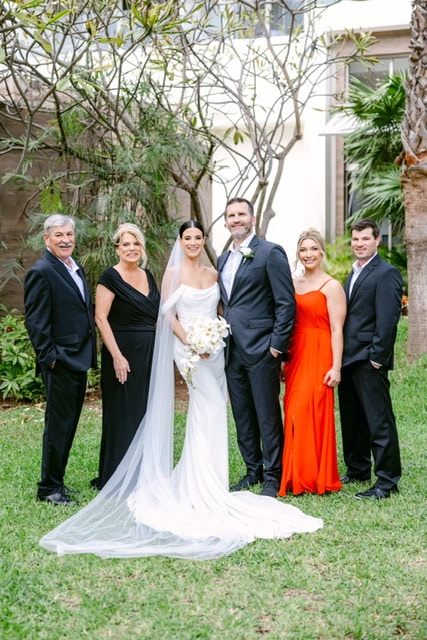 Diane poses for a photo with her family at her daughter's wedding.